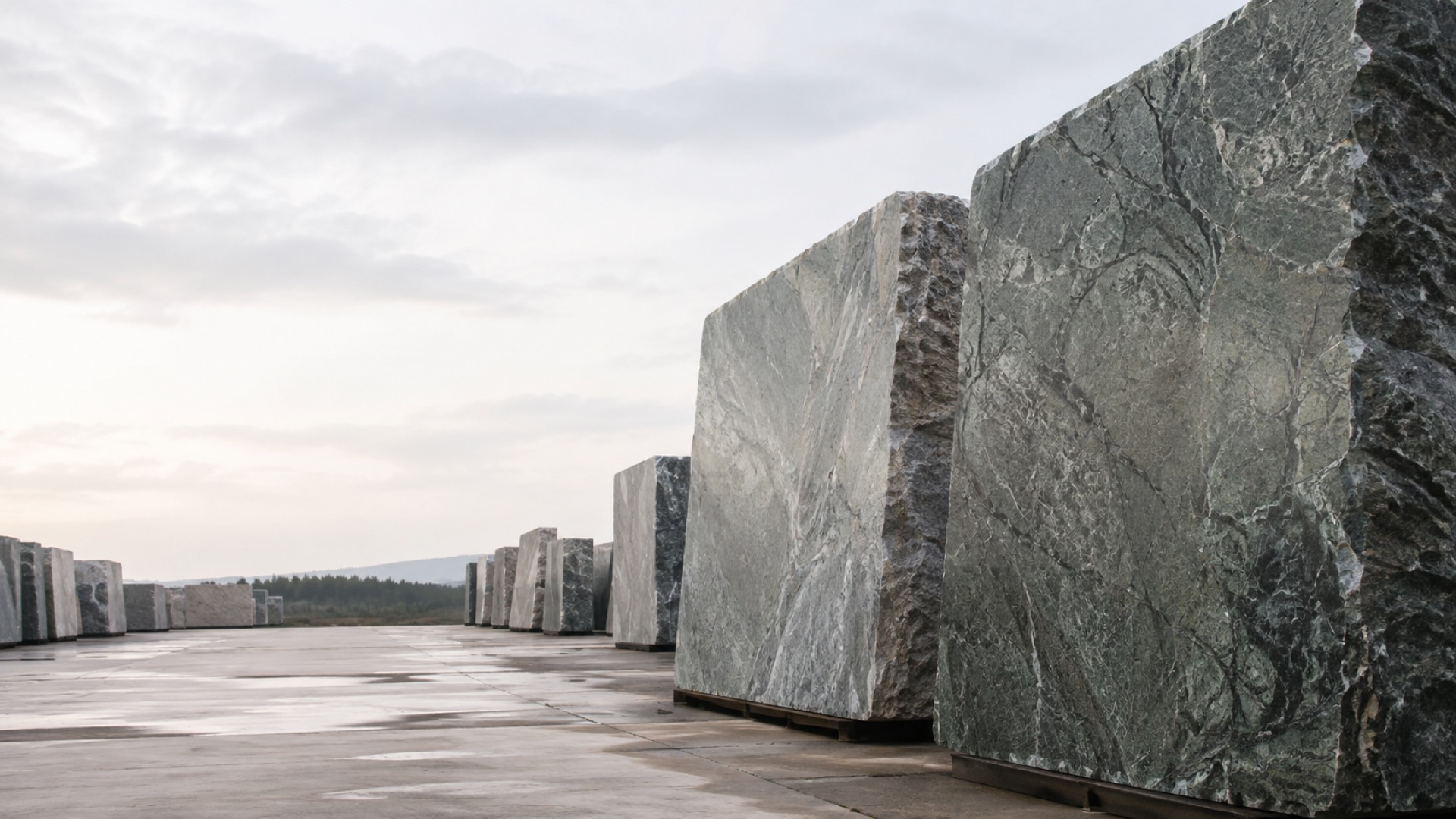 Large granite slabs arranged in a stone yard