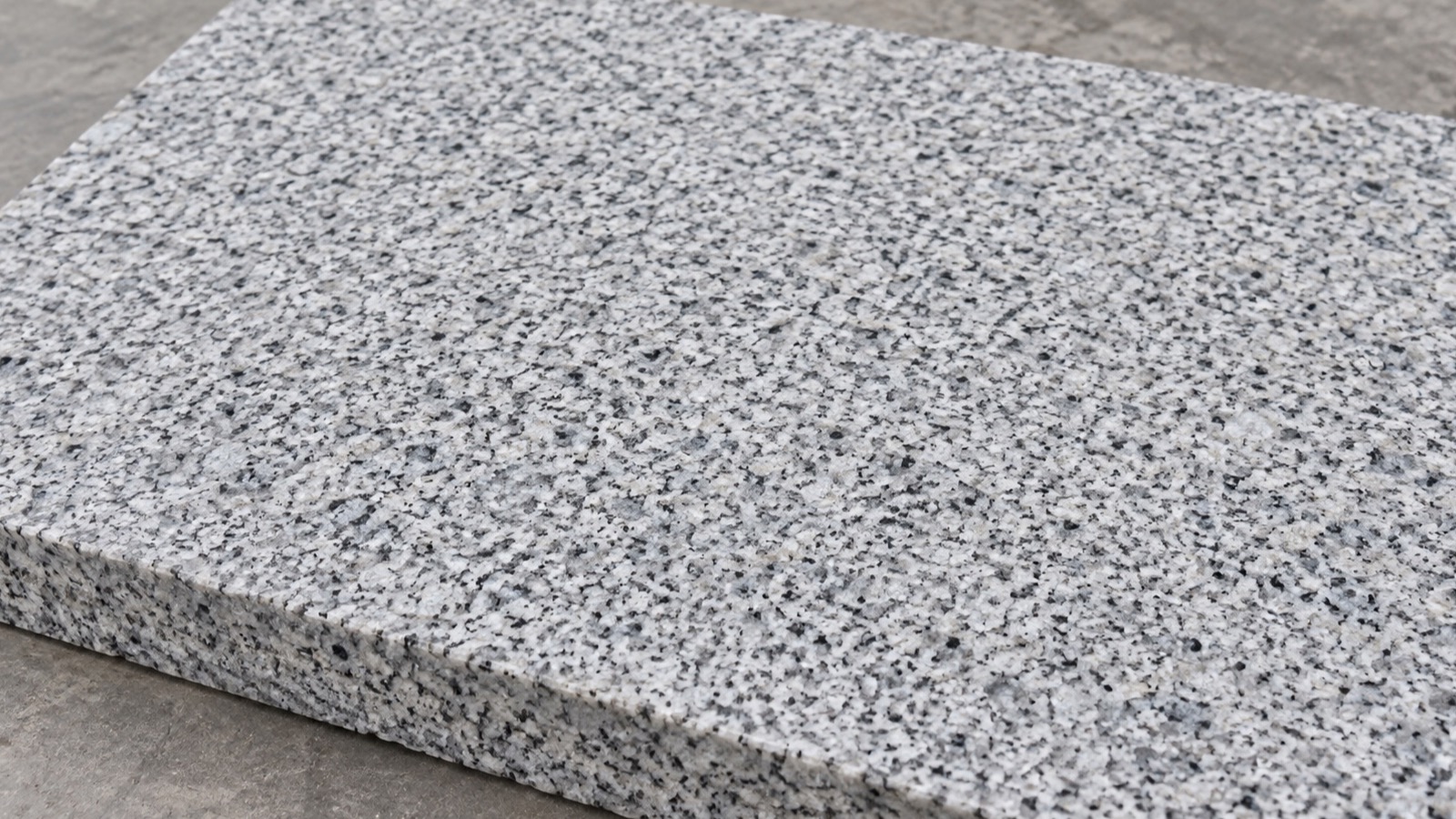 Light grey speckled granite sample with even crystalline grain